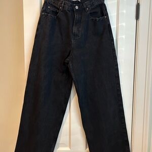 COLE HENRY baggy relaxed fit jeans with distressed pockets and hem.